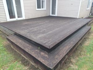 Before photo of a dark and slippery deck in Inglewood before a Deck Clean & Restore by Woosh Exterior Cleaning Taranaki NZ