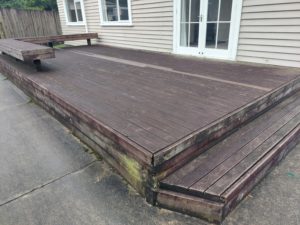 Before photo of a dark and slippery deck in Inglewood before a Deck Clean & Restore by Woosh Exterior Cleaning Taranaki NZ