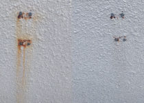 Rust Stains on Painted Stucco House